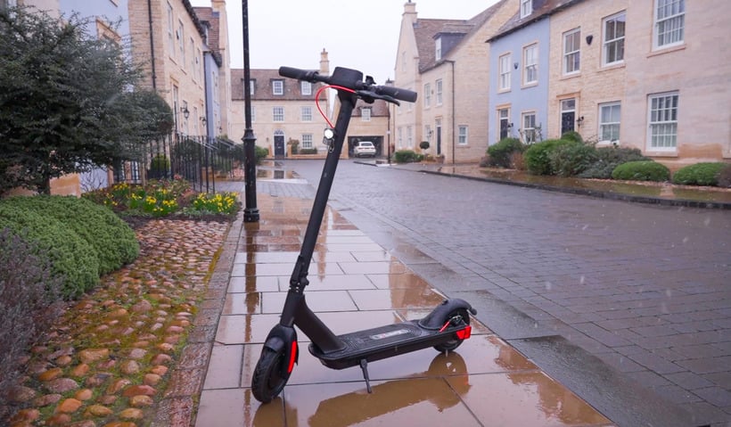 waterproof e-scooter on the street during rain weather