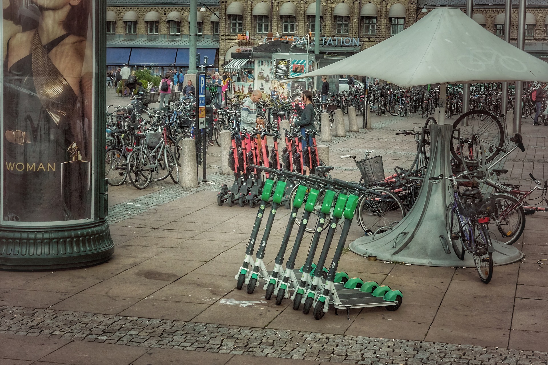 abroad city with huge quantity of parked electric scooters and different electric mobility