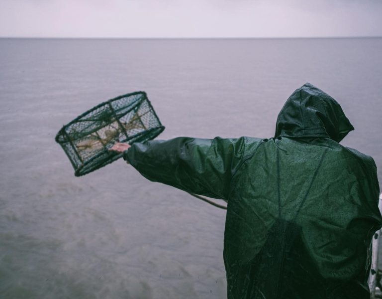 man protect himself from extremly wet and stormy weather